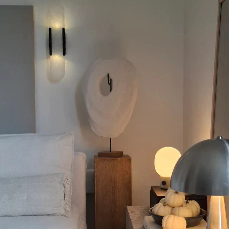 "Elegant black & gold LED wall lamp with sleek metal finish, perfect for modern interiors, offers stylish, warm lighting."