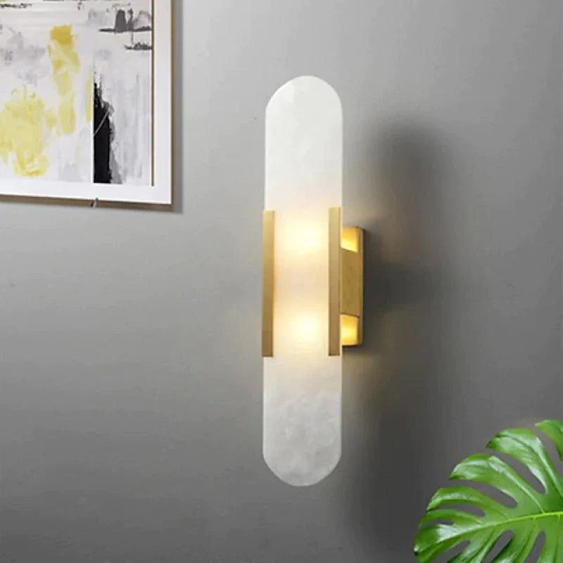 "Elegant black & gold LED wall lamp with sleek metal finish, perfect for modern interiors, offers stylish, warm lighting."