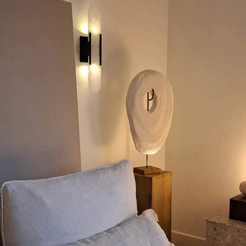 "Elegant black & gold LED wall lamp with sleek metal finish, perfect for modern interiors, offers stylish, warm lighting."