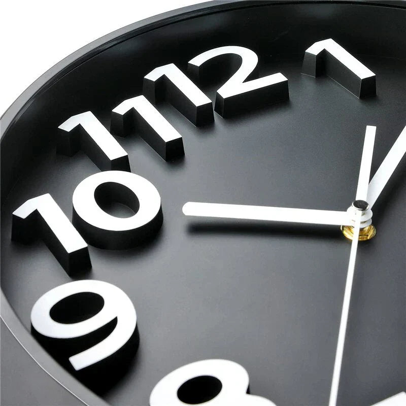 Modern minimalist wall clock with sleek black rim and silent operation, enhancing any room with its sophisticated design.
