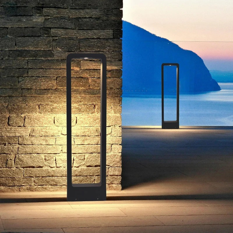 "Sleek waterproof outdoor LED garden light illuminating garden paths, robust aluminum build with modern minimalist design."
