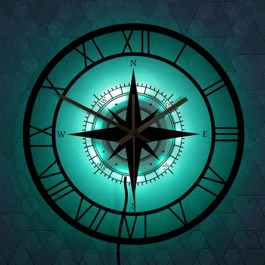 Elegant nautical compass wall clock with vintage design; circular shape with high-quality metal and acrylic finish.
