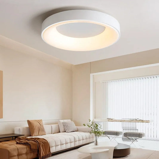 Modern circular LED ceiling light with sleek metal frame, soft ambient lighting; available in grey, white, wood finishes.